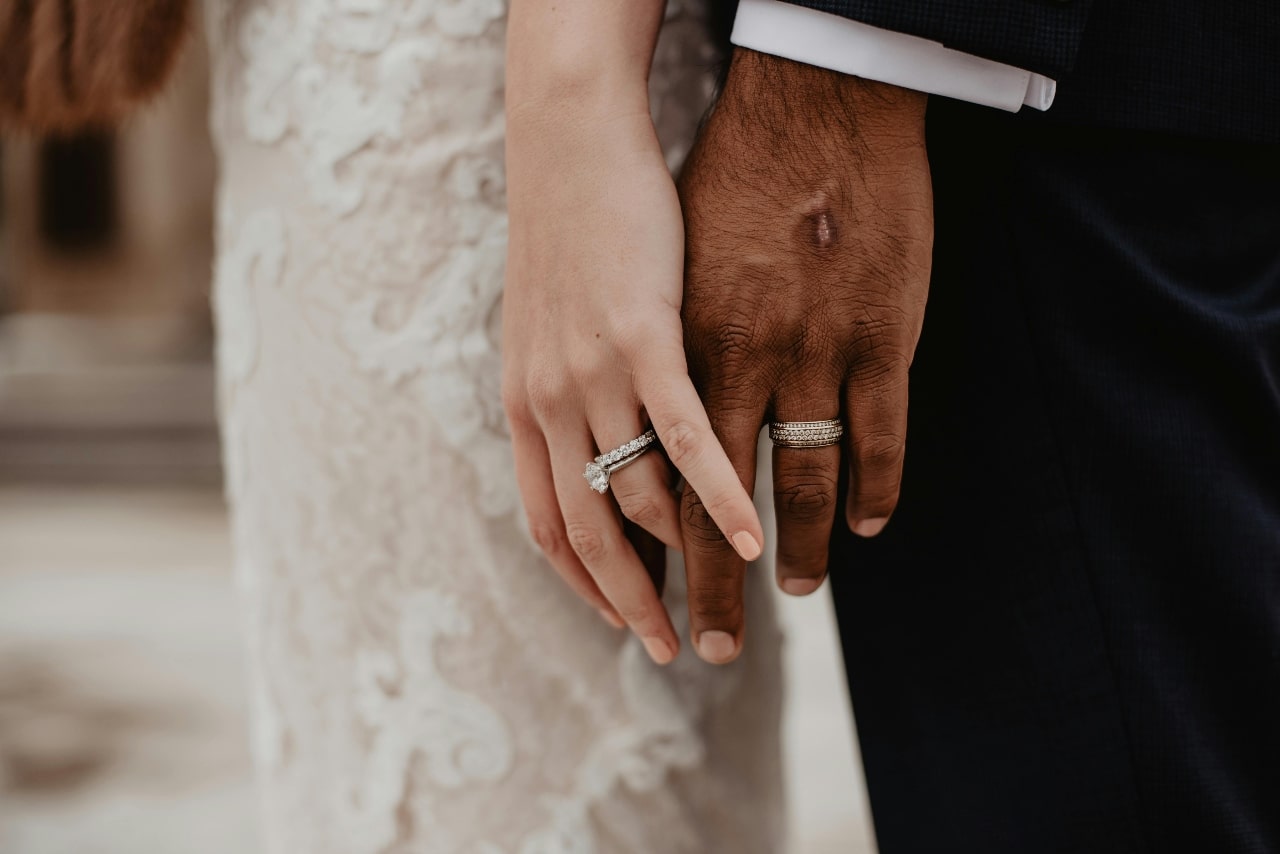 A couple standing together holding